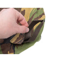 Close-up of hand holding strap on Dutch military bivy sack in DPM camouflage Goretex waterproof fabric