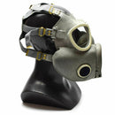 Polish Military MP-4 vintage gas mask in olive green with rubber facepiece and adjustable straps on black mannequin head