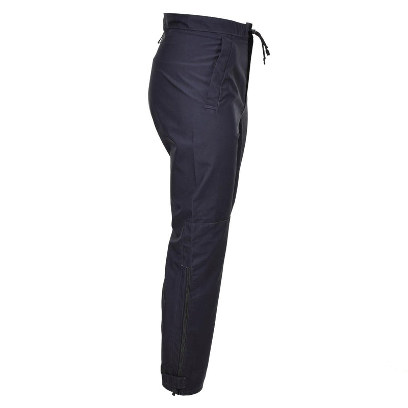 Side view of genuine British police waterproof rain trousers in blue with adjustable waist and ankle straps.