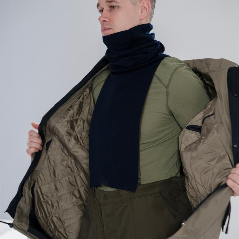Man wearing Genuine Dutch Military thermal long sleeve shirt with high neck base layer under coat