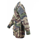 Side view of genuine French army parka T4 combat jacket in CCE camo, with multiple pockets and drawstring waist.