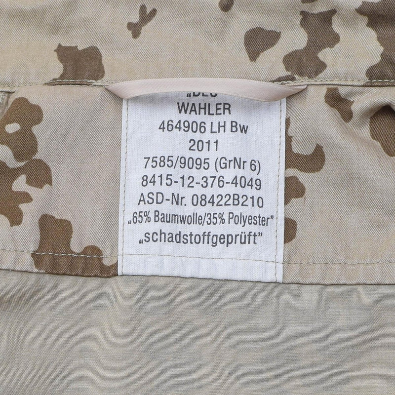 Close-up of label inside Genuine Georgian Army Tropentarn camouflage field blouse showing material and manufacturing details