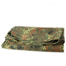 Folded Genuine German Army waterproof tent poncho with Flecktarn camouflage pattern on white background
