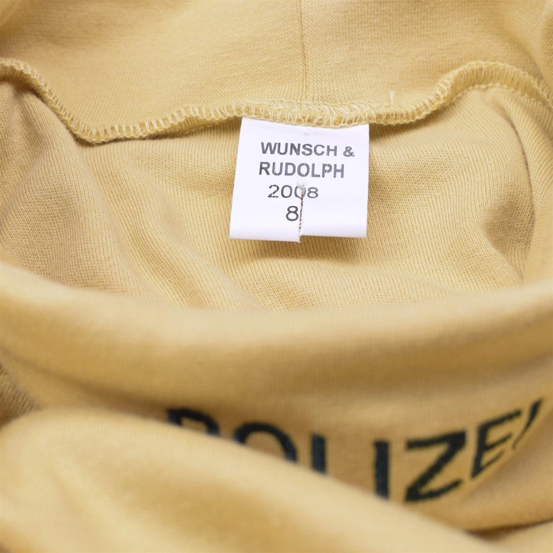 Close-up of sand-colored genuine German military police undershirt with WUNSCH & RUDOLPH label inside turtle neck collar.
