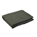 Folded dark green blanket on a white background