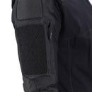 Close-up of black Mil-Tec tactical combat shirt sleeve with padding, zipper pocket, and durable stitching details.
