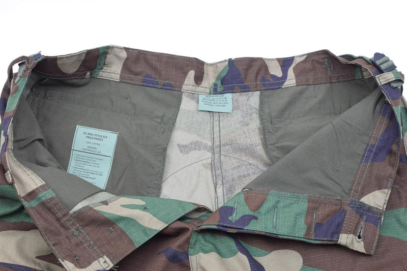Interior view of Mil-Tec U.S. Army style woodland camouflage ripstop BDU cargo pants with adjustable waist tabs