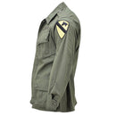 Side view of Mil-Tec U.S. Military style olive drab M64 Vietnam jungle jacket with patch on sleeve and buttoned pockets