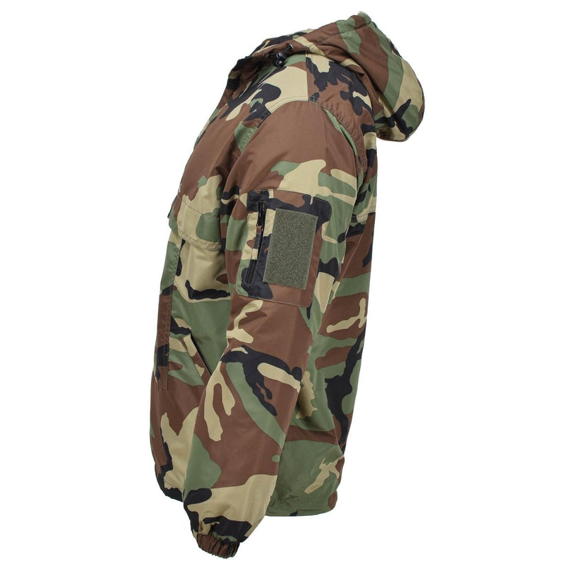 Side view of MIL-TEC German Military winter woodland camouflage combat jacket with hood and lined interior