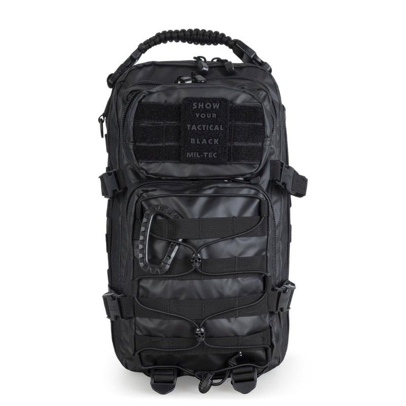 Black MIL-TEC U.S. Assault tactical backpack with multiple compartments and adjustable padded shoulder straps.