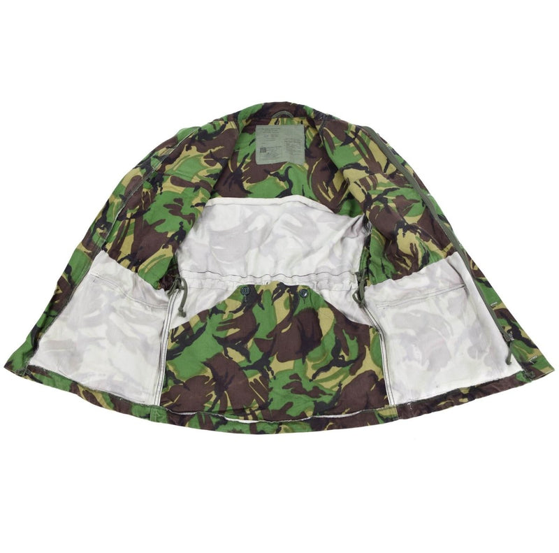 Inside view of a British army woodland camo BDU combat smock jacket showing lining and inner pockets.