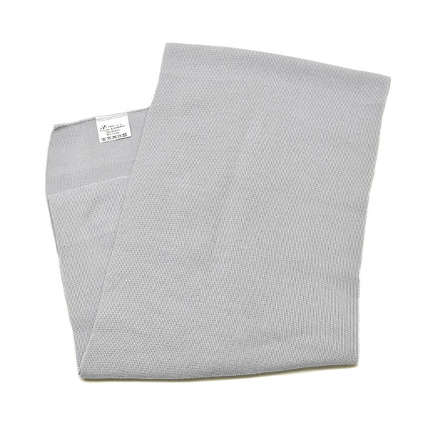 Folded gray fabric with a subtle pattern on a white background