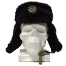 Black faux fur German police winter ushanka hat with ear flaps and badge displayed on white mannequin head