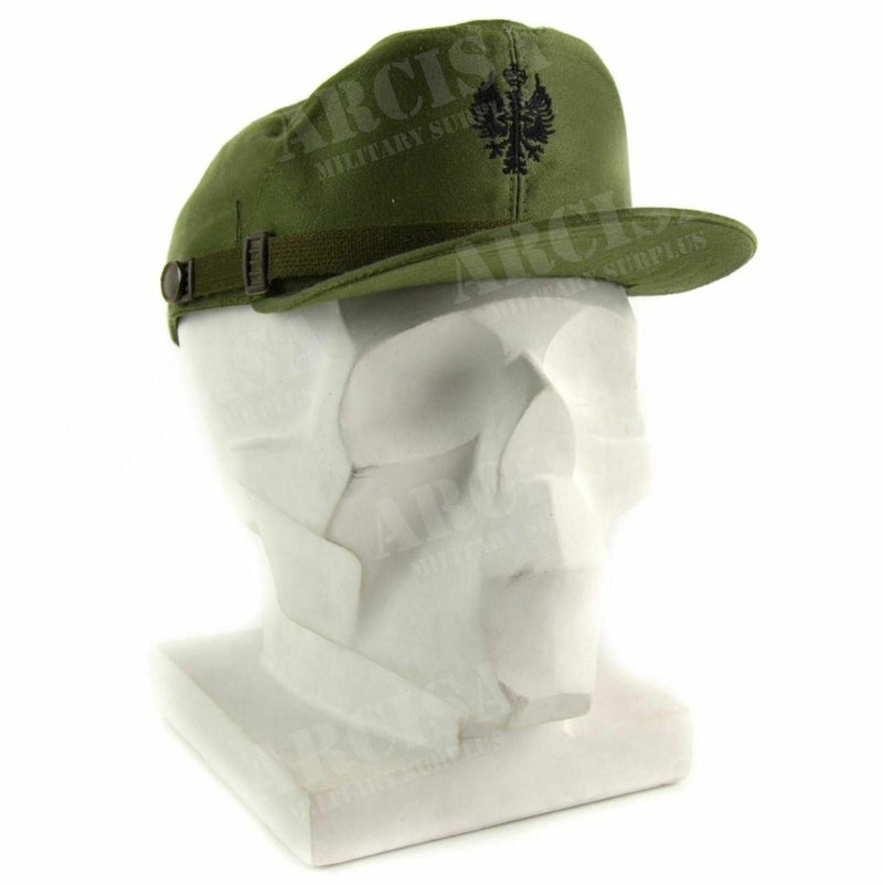 Olive green Spanish military visor cap with chin strap and embroidered emblem displayed on a white mannequin head