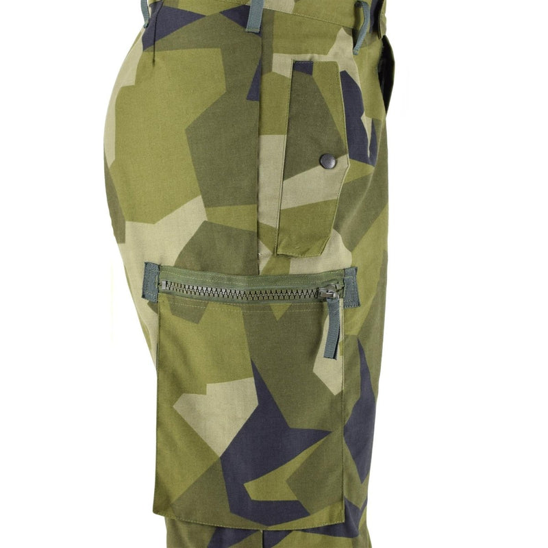 Close-up of Original Swedish military M90 pants in splinter camouflage with reinforced knees and multiple secure pockets.