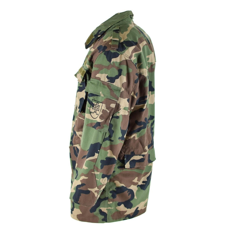 Original vintage Slovakian M97 camo military field jacket with multiple pockets and adjustable cuffs and waist.