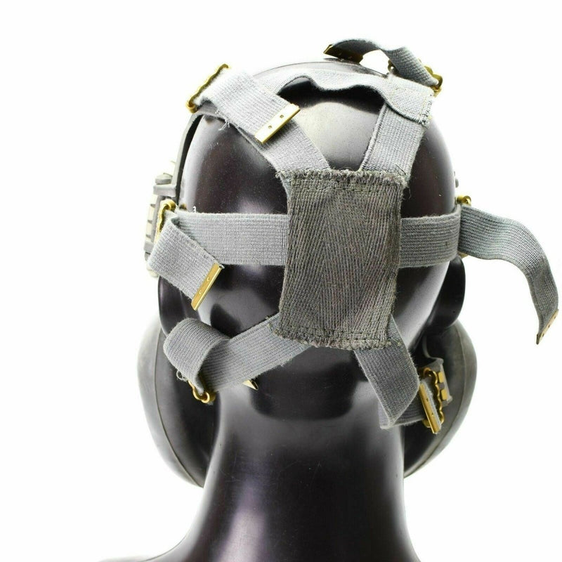 Back view of Polish Military MP-4 gas mask with adjustable grey olive straps on black mannequin head.