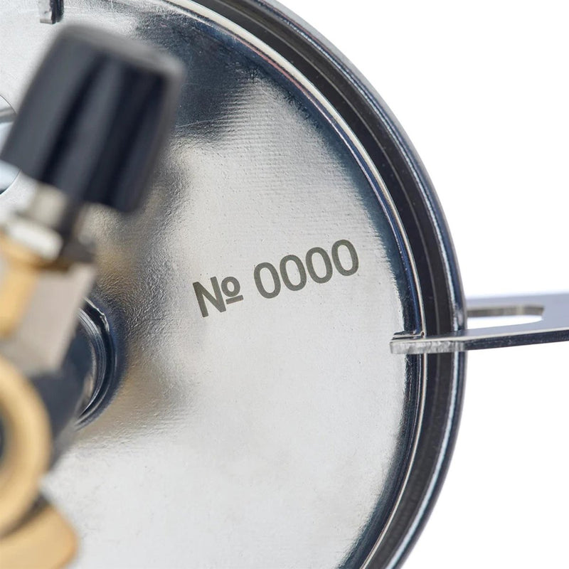 Close-up of the Primus ClassicTrail Stove 130 camping burner showing the metal base with serial number 0000.