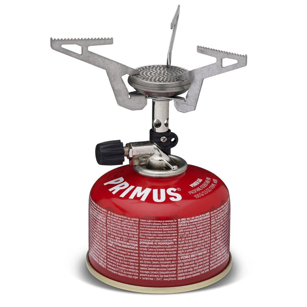 Primus Express lightweight foldable pocket camping stove attached to a red gas canister for outdoor use