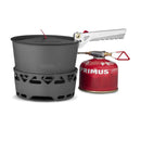 Primus PrimeTech camping stove set with 1.3L pots, burner, foldable handle, and red fuel canister for outdoor cooking.