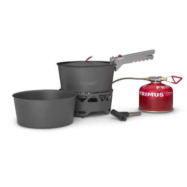 Primus PrimeTech 1.3L camping stove set with two pots, burner, fuel canister, and pot gripper for outdoor cooking