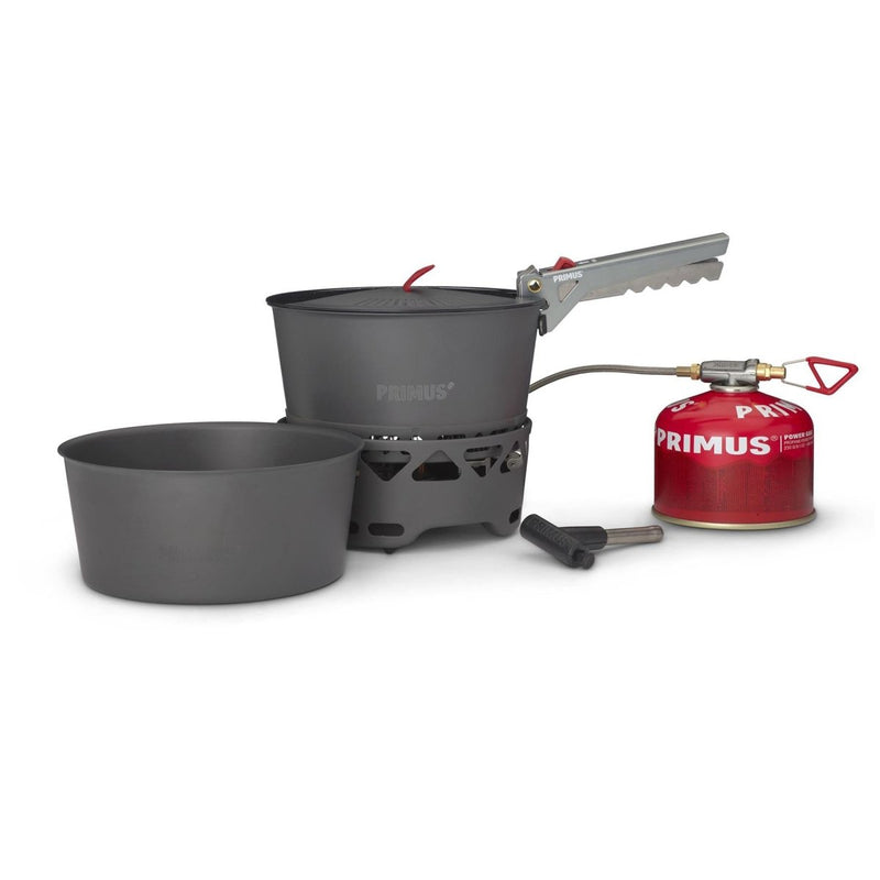 Primus PrimeTech 1.3L camping stove set with two pots, burner, fuel canister, and pot gripper for outdoor cooking