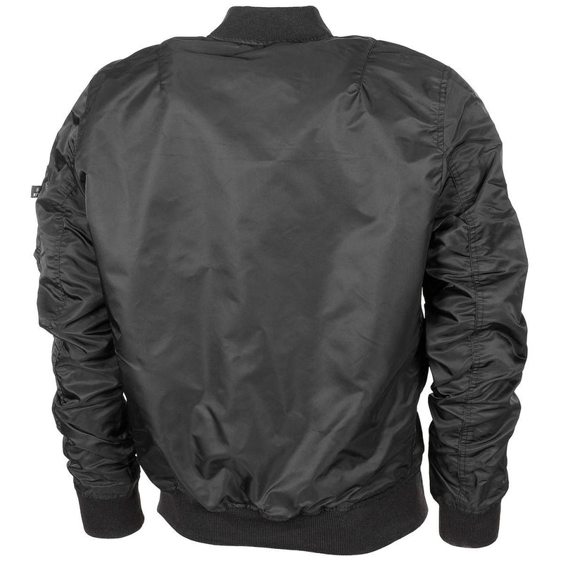 Back view of black U.S. Air Force MA1 bomber jacket with ribbed cuffs, waistband, and arm pocket detail