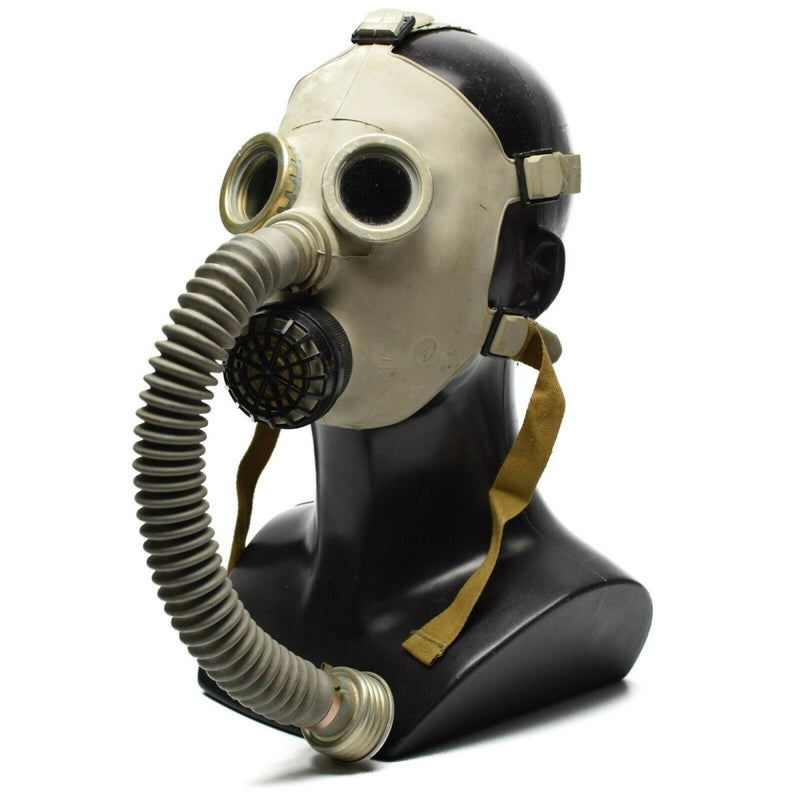 Vintage Soviet PDF-7 military gas mask with breathing hose, rubber construction, and round eyelets on black mannequin head