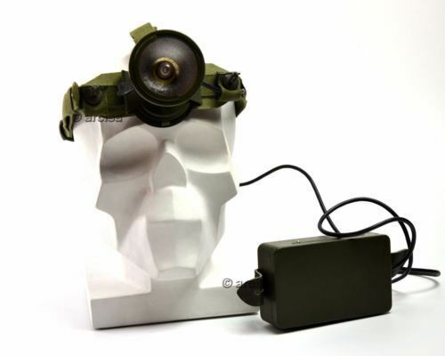 Headlight on a white bust with a power adapter on a white background